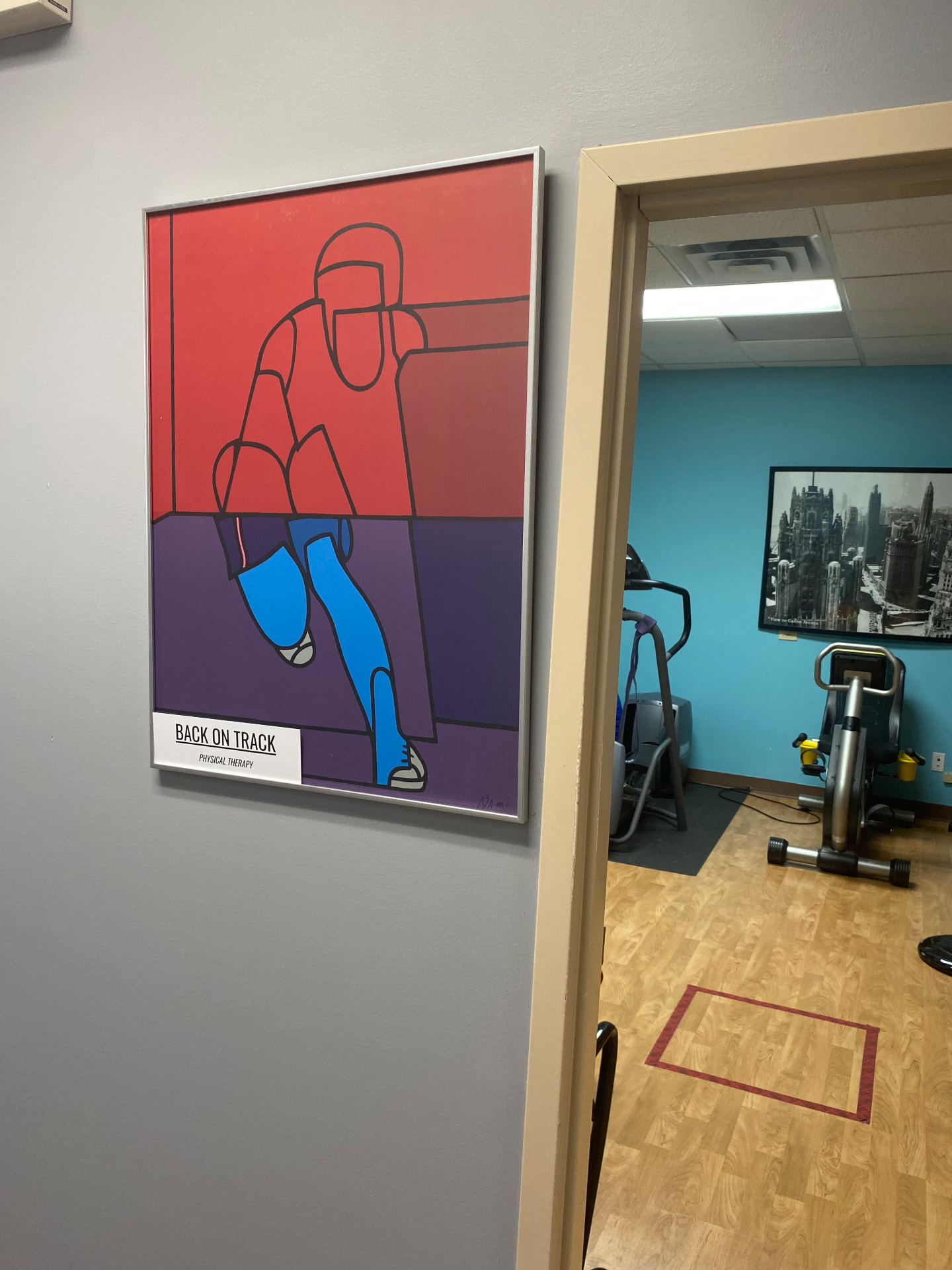 The Back on Track Physical Therapy sign and treatment gym at the Buffalo Grove office